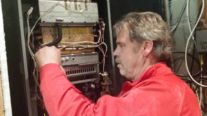 Technician Repairing Boiler